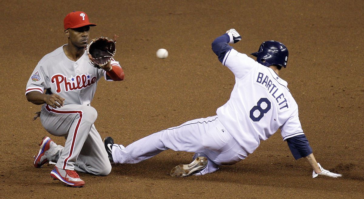 Tampa Bay’s Jason Bartlett steals second base as Philadelphia’s Jimmy Rollins takes the throw during the fifth inning. (Associated Press / The Spokesman-Review)