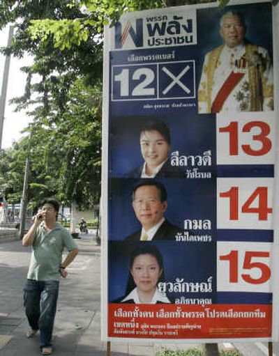 
A man stands next to an election campaign billboard for People's Power Party candidates in Bangkok, Thailand, on Saturday. Associated Press
 (Associated Press / The Spokesman-Review)