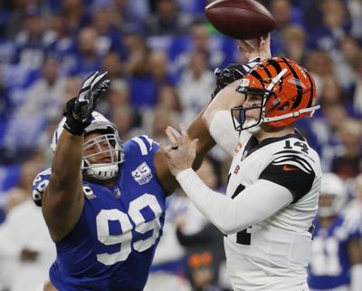 In this Sept. 9, 2018 photo, Indianapolis Colts defensive tackle Al Woods (99) pressures Cincinnati Bengals quarterback Andy Dalton (14) during the first half of an NFL football game, in Indianapolis. (John Minchillo / Associated Press)