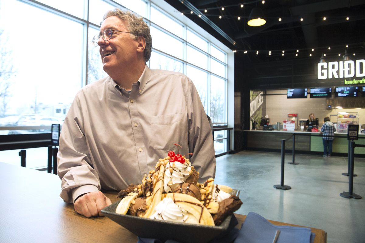 Spokesman-Review columnist Paul Turner takes some ribbing before diving into a giant 16-scoop sundae contest at the Spokane Arena. (Jesse Tinsley / The Spokesman-Review)