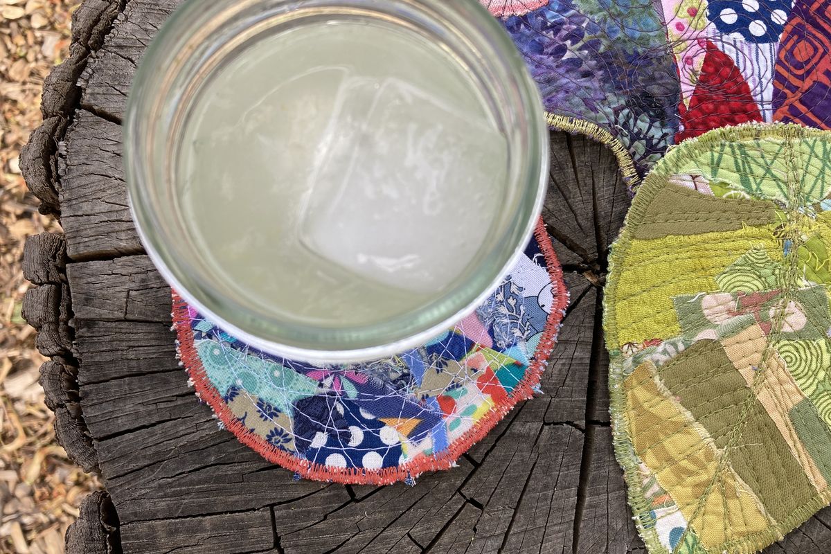 These colorful coasters are a great way to use up scraps of fabric from other projects.  (Katie Patterson Larson/For The Spokesman-Review)
