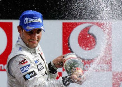 
Juan Pablo Montoya celebrates his victory.
 (Associated Press / The Spokesman-Review)