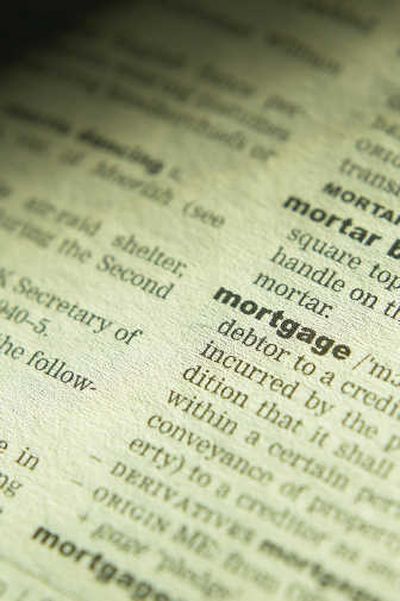 
Delinquencies are already soaring from the subprime lending problems, and the peak for this is likely to be in October when many adjustable-rate mortgages reset to higher interest rates.
 (Photos.com / The Spokesman-Review)