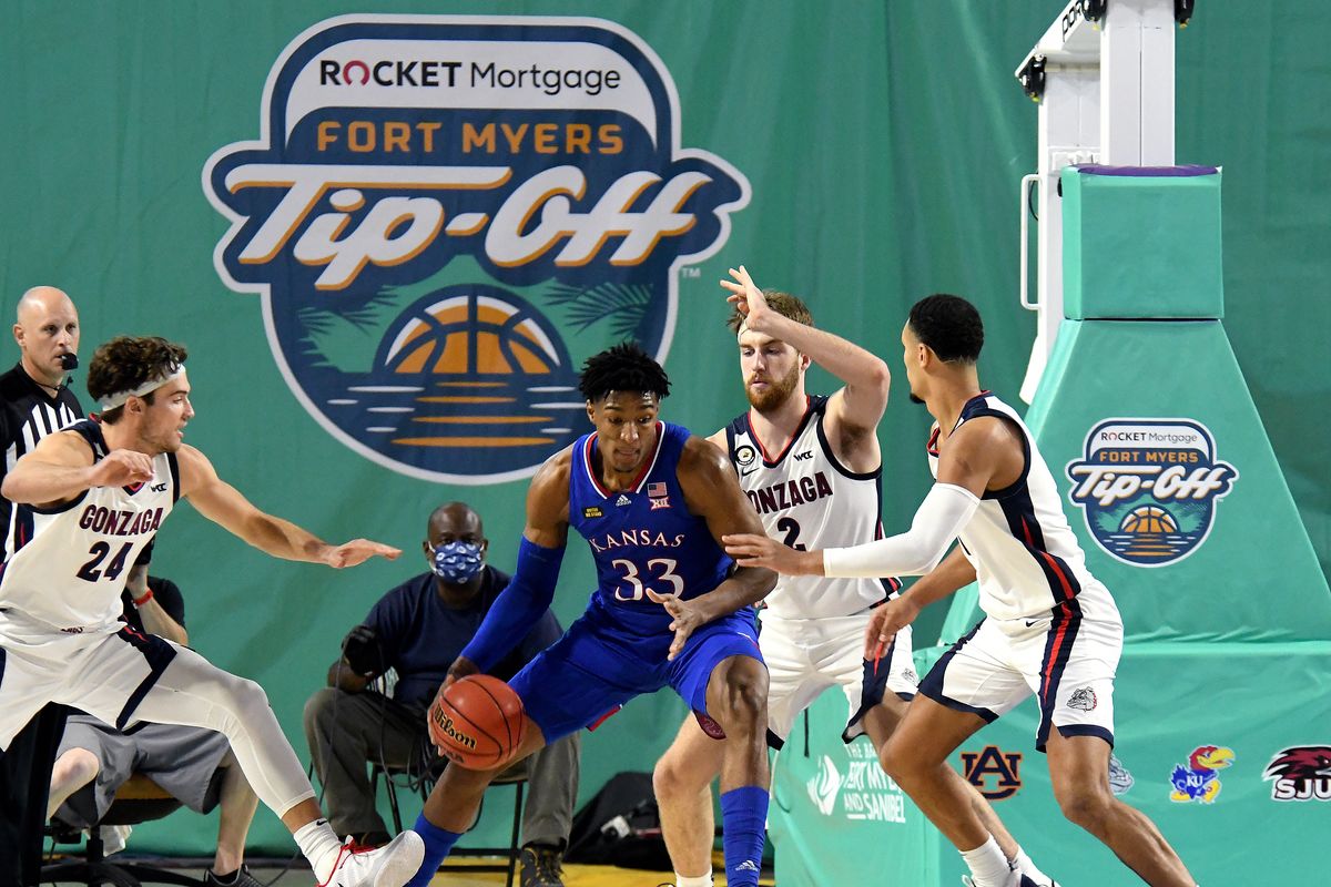 Kansas forward David McCormack is surrounded by (from left) Gonzaga’s Corey Kispert, Drew Timme and Jalen Suggs on Thursday at the Fort Myers Tip-Off in Fort Myers, Fla. The Bulldogs held the 6-foot-10, 265-pound junior to just eight points.  (Chris Tilley/Fort Myers Tip-Off)