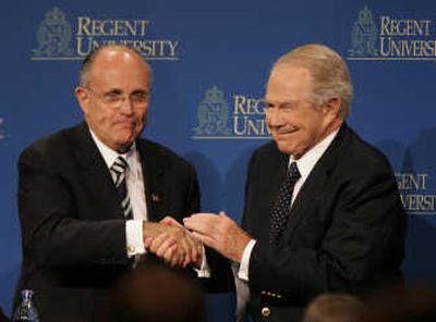 
Rudy Giuliani is welcomed to Christian Regent University by its founder, the Rev. Pat Robertson, on Tuesday.Associated Press
 (Associated Press / The Spokesman-Review)