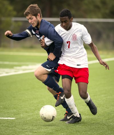 Mt. Spokane’s Alex Foust, left, and Ferris’ Jonathan Galgalo jostle for the ball during Friday afternoon’s Greater Spokane League boys soccer match at Merkel Sports Complex. Mt. Spokane won 1-0 to break a second-place tie with Ferris. (Colin Mulvany)