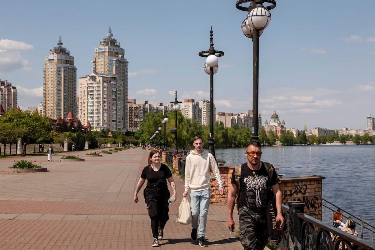 People walked along the Dnieper river in the Obolon district in Kyiv, Ukraine, on May 11.  (New York Times)