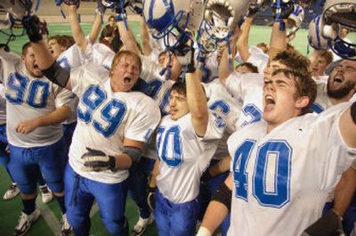Tigercat seniors Kellen Hays (90), Michael Martin (99), Tyler Martin (30) and Matt Martin (40) celebrate with their teammates after posting a state-tying 48th consecutive victory.
(Kevin Nibur/ / The Spokesman-Review)