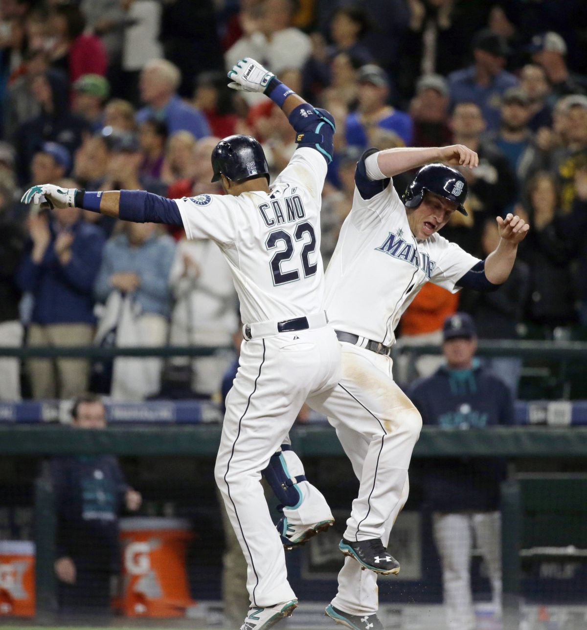 M’s Robinson Cano, left, celebrates his 20th home run of season – a two-run shot – with Kyle Seager. (Associated Press)