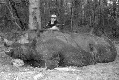 
 Jamison Stone, 11, poses with a wild pig he killed  May 3. 
 (Associated Press / The Spokesman-Review)