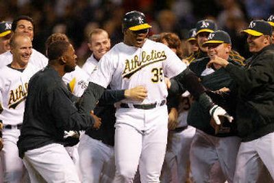 
A's Frank Thomas, celebrating a game-winning homer, has proven he can still play. 
 (Associated Press / The Spokesman-Review)