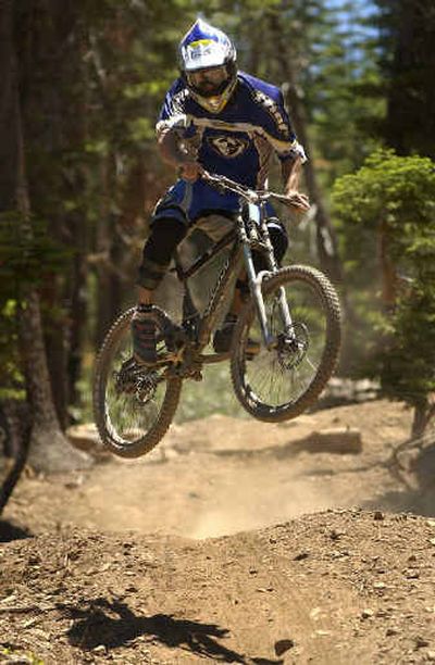 
Reno freerider Jason Blanchard rides a banked bridge, a manmade obstacle, at the Northstar mountain bike park near Truckee, Calif. Reno freerider Jason Blanchard rides a banked bridge, a manmade obstacle, at the Northstar mountain bike park near Truckee, Calif. 
 (Associated PressAssociated Press / The Spokesman-Review)