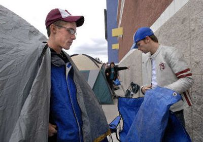 Steve Frostad, 21, and Daniel Edvalson set up their tent next to Best Buy at the Spokane Valley Mall on Wednesday. A small tent city has taken root as buyers of the new PS3 are waiting for the gaming unit to go on sale Friday. The two young men were in line behind Alex Bistrevsky, center, age 16, of Spokane Valley.
 (Dan Pelle / The Spokesman-Review)