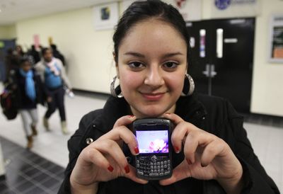 Tatiana Mesa holds up her Blackberry, which recently replaced her missing Sidekick, at the Boston Arts Academy. Boston police reported more than 300 stolen Sidekicks in 2008 – 14 percent of all robberies in the city.  (Associated Press / The Spokesman-Review)