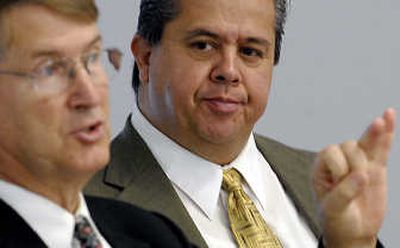 
Coeur d'Alene School District Superintendent Harry Amend, left, introduces state Superintendent Tom Luna during a meeting  Thursday. 
 (Kathy Plonka / The Spokesman-Review)