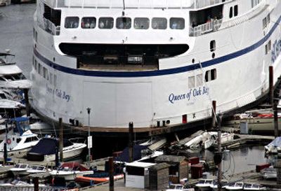 
Several boats are crushed after the ferry Queen of Oak Bay smashed into a dock at Horseshoe Bay in West Vancouver, British Columbia, on Thursday.
 (Associated Press / The Spokesman-Review)
