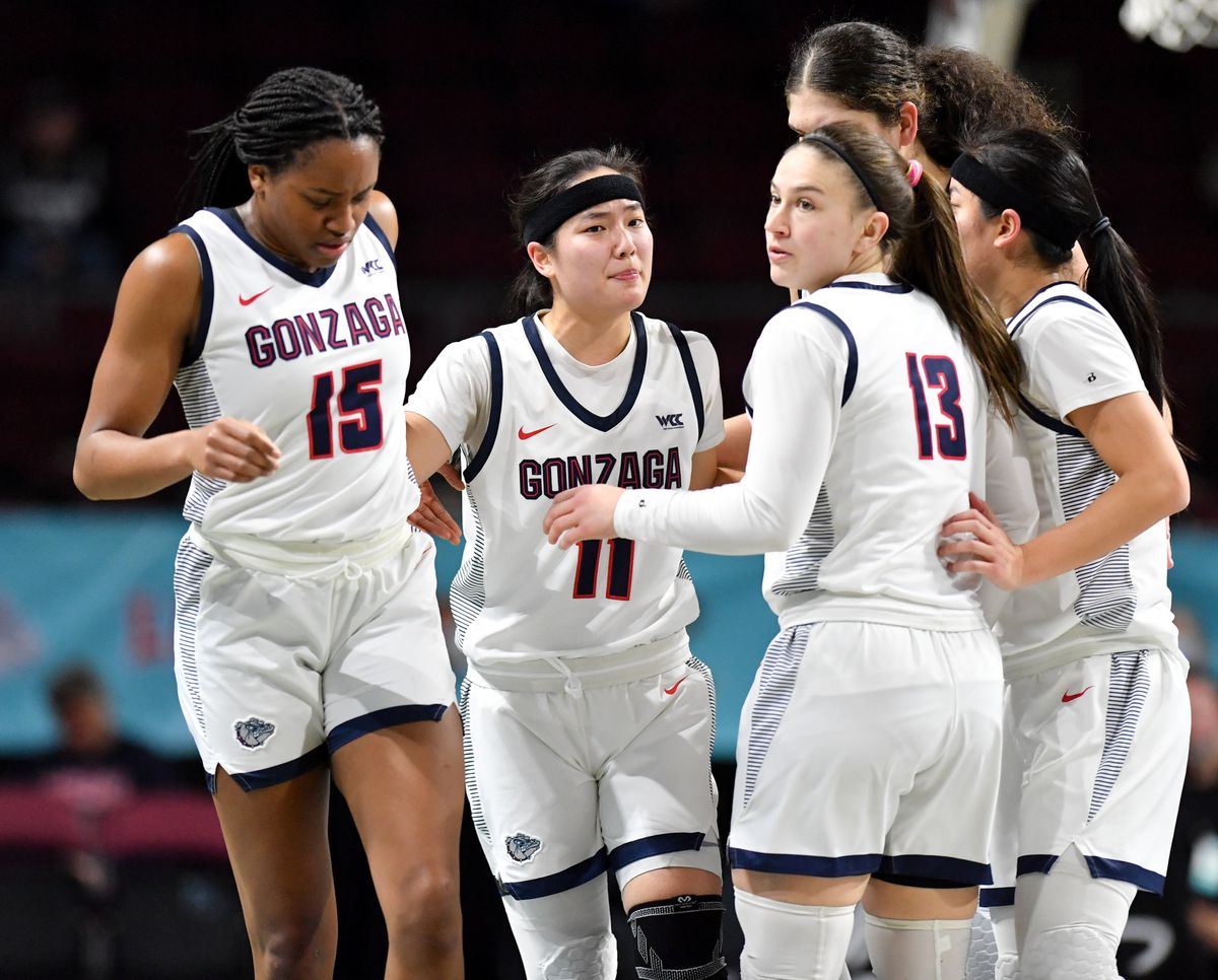 Gonzaga players huddle before a timeout against San Francisco during Monday’s WCC Tournament semifinal game in Las Vegas.  (Tyler Tjomsland/The Spokesman-Review)