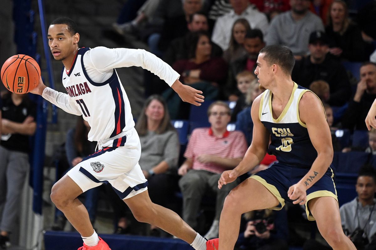 Gonzaga guard Nolan Hickman (11) makes the turn to head downcourt as Eastern Oregon guard Malachi Afework (10) defends during the first half of a NCAA college basketball game, Tuesday, Nov. 14, 2023, in the McCarthey Athletic Center.  (Colin Mulvany / The Spokesman-Review)