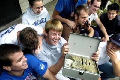 
Gonzaga University student Mitch Holda holds $5,000 that he and fellow students raised for Hurricane Katrina survivors. 
 (Holly Pickett / The Spokesman-Review)