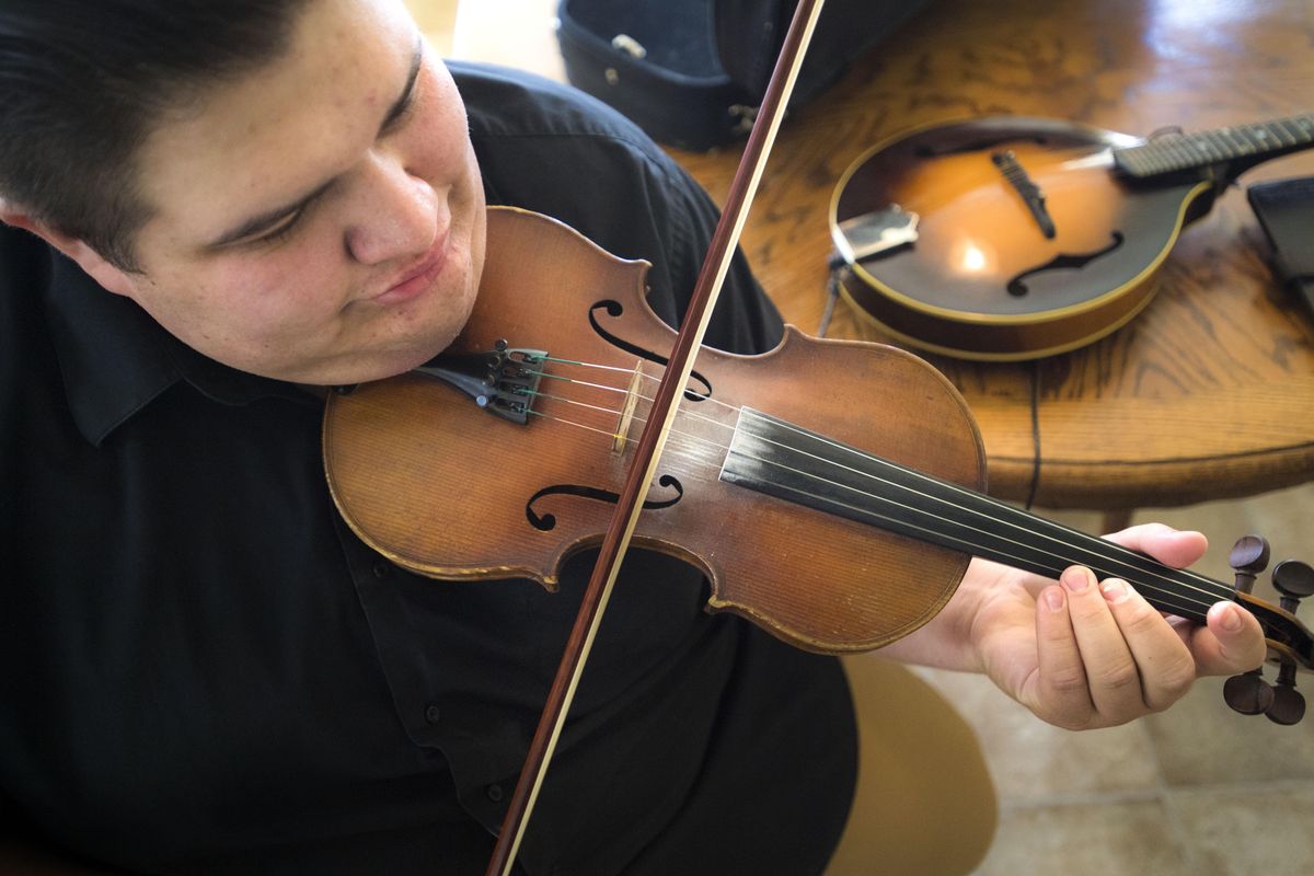 Aaron Castilla is a 21-year-old fiddling and mandolin bluegrass sensation who lives in Spokane Valley. Later this month he leaves for California where he’s landed a gig with a respected touring bluegrass/swing band. This could be a big break. Aaron has world-class chops and the potential of being a major player. (Dan Pelle / The Spokesman-Review)