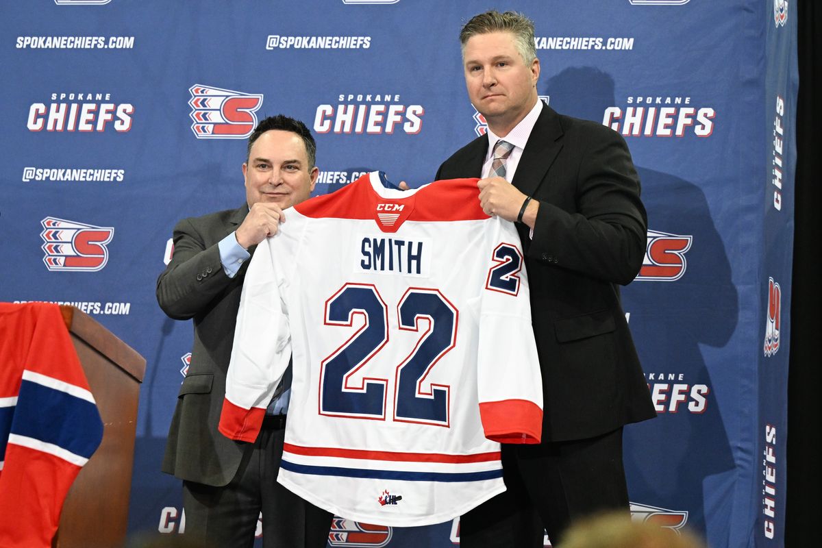 The Spokane Chiefs general manager Matt Bardsley, left, introduces new head coach Ryan Smith during a press conference on Monday, Jun 27, 2022, at Spokane Memorial Arena in Spokane, Wash.  (Tyler Tjomsland/The Spokesman-Review)