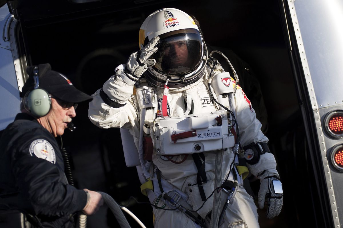 FILE - In this Thursday, March 15, 2012 file photo provided by Red Bull Stratos, Felix Baumgartner salutes as he prepares to board a capsule carried by a balloon during the first manned test flight for Red Bull Stratos in Roswell, N.M. On Monday, Oct. 8, 2012 over New Mexico, Baumgartner will attempt to jump higher and faster in a free fall than anyone ever before and become the first skydiver to break the sound barrier. (Joerg Mitter / Red Bull Stratos)