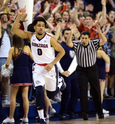 Gonzaga guard Silas Melson (0) celebrates a 3-pointer during the second half of a NCAA college basketball game, Thurs., Feb. 18, 2016, in the McCarthey Athletic Center. (Colin Mulvany / The Spokesman-Review)