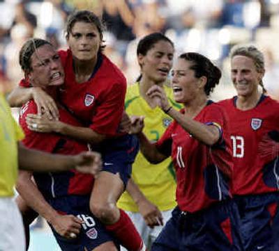 
Mia Hamm, second from left, celebrates with Abby Wambach, left, Julie Foudy and Kristine Lilly after scoring against Brazil.
 (Associated Press / The Spokesman-Review)