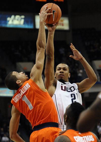 Omar Calhoun, right, blocked out this play to score 15. (Associated Press)
