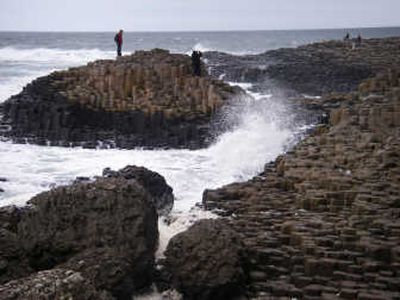 
This October 2007 photo shows visitors among the basalt columns at Giants Causeway in County Antrim in Northern Ireland. Associated Press
 (File Associated Press / The Spokesman-Review)