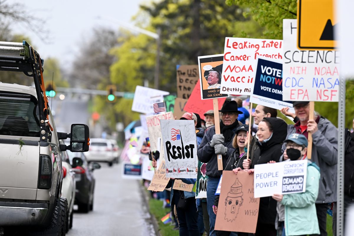 Protesters line Mission Avenue during a Rally for Science protesting the policies of Pres. Donald Trump held by Spokane Indivisible on Saturday, Apr. 19, 2025, at Mission Park in Spokane, Wash.  (Tyler Tjomsland/The Spokesman-Review)