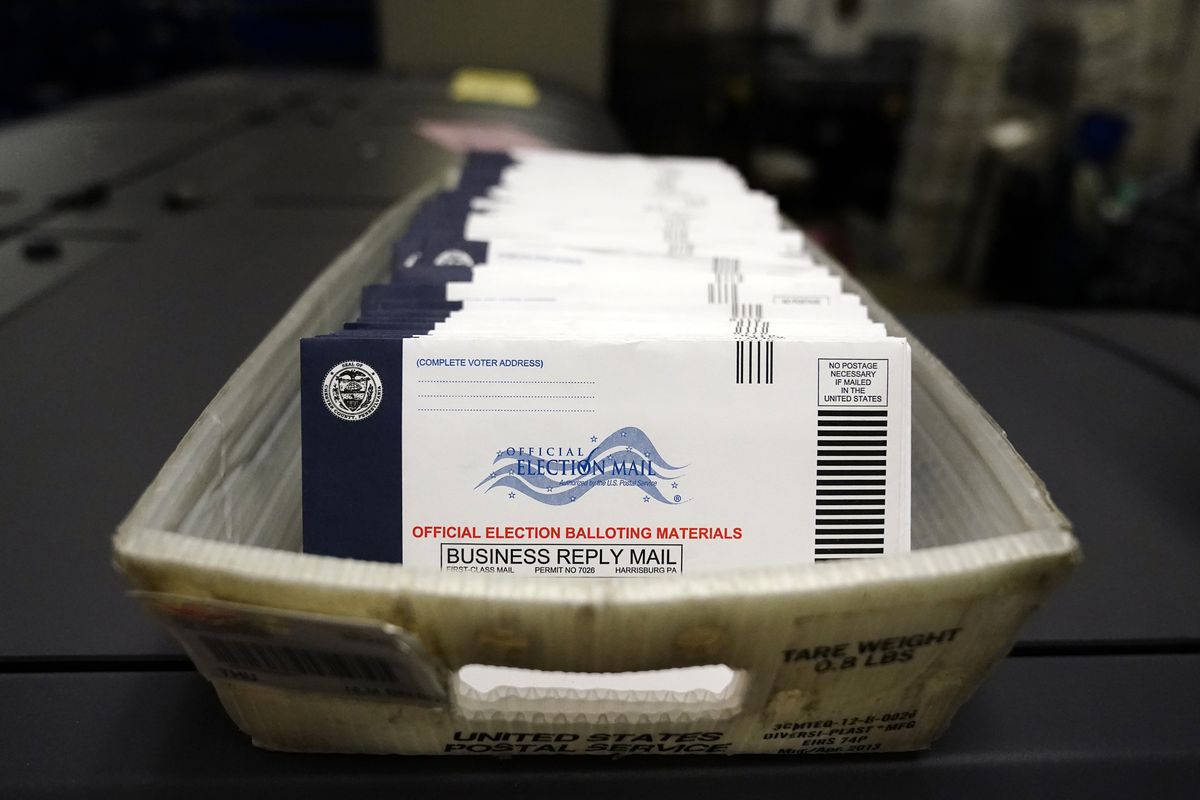 This file photo from Oct. 23, 2020, shows mail-in ballots for the U.S. 2020 General Election before being sorted at the Chester County Voter Services office, in West Chester, Pa. A statewide court said Friday Jan. 28, 2022 that Pennsylvania
