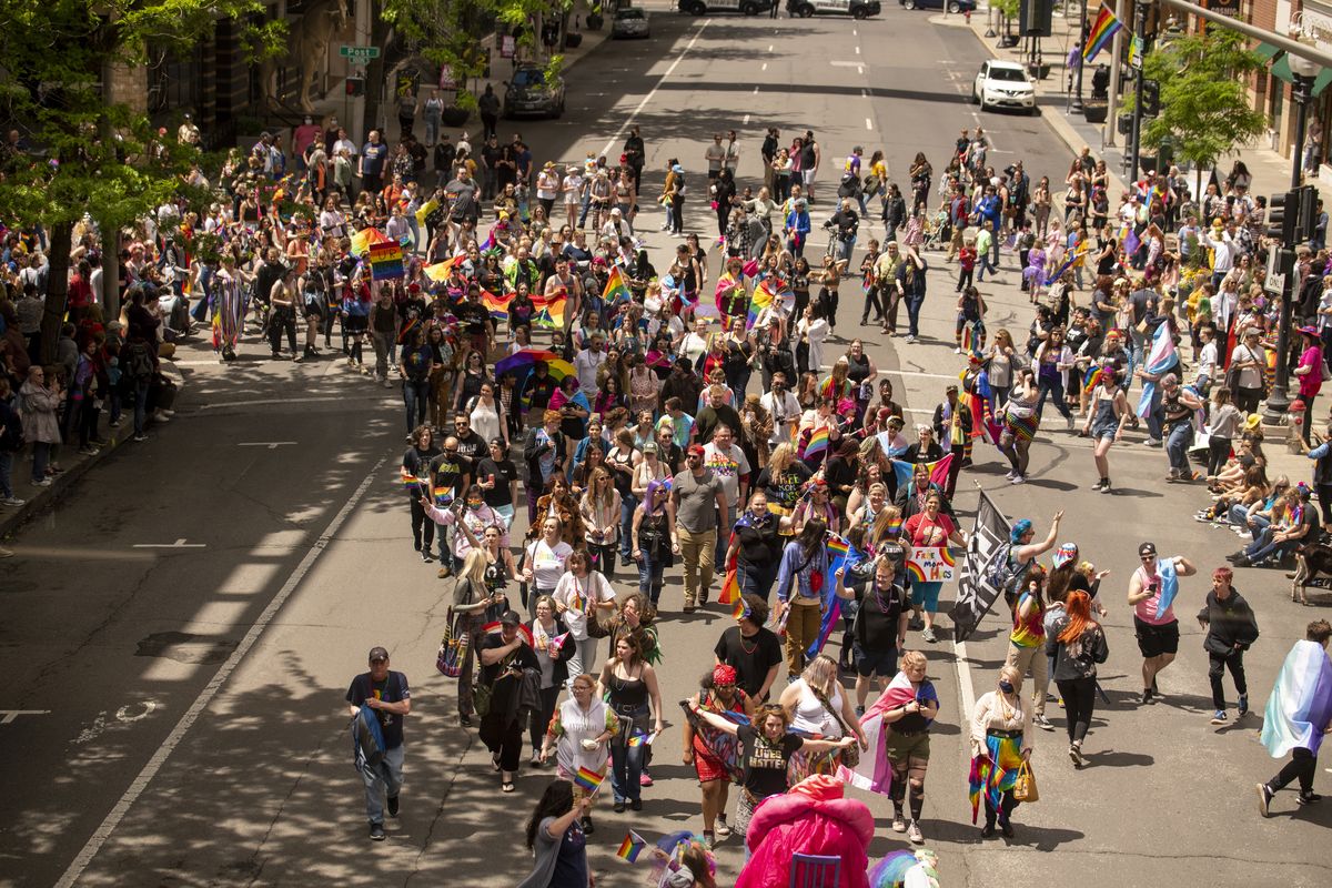 Parade marchers interact with an enthusiastic crowd along the route of the Spokane Pride Parade at Post Street and Main Avenue Saturday, Jun 11, 2022 in downtown Spokane, Washington.  (Jesse Tinsley/THE SPOKESMAN-REVIEW)