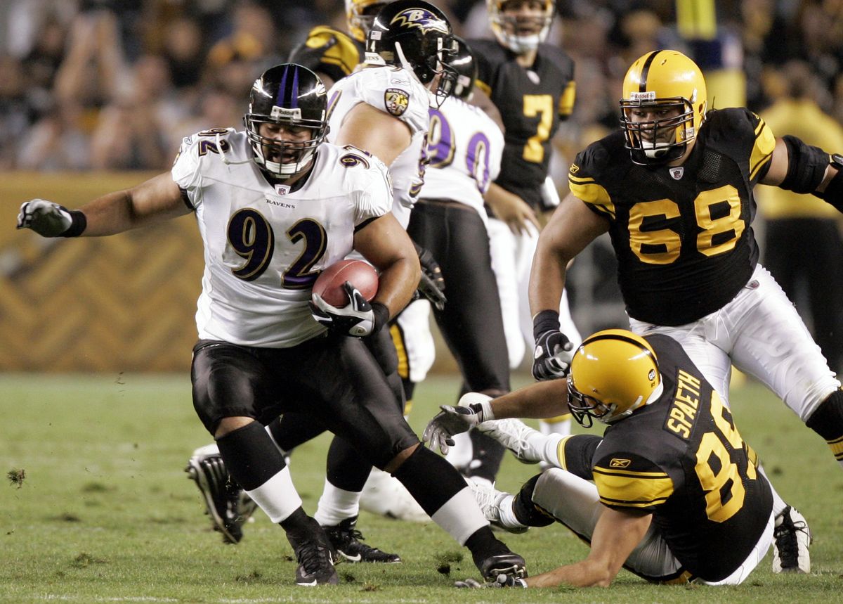 Baltimore nose tackle Haloti Nagota eludes Steelers after picking off a  Ben Roethlisberger pass.  (Associated Press / The Spokesman-Review)