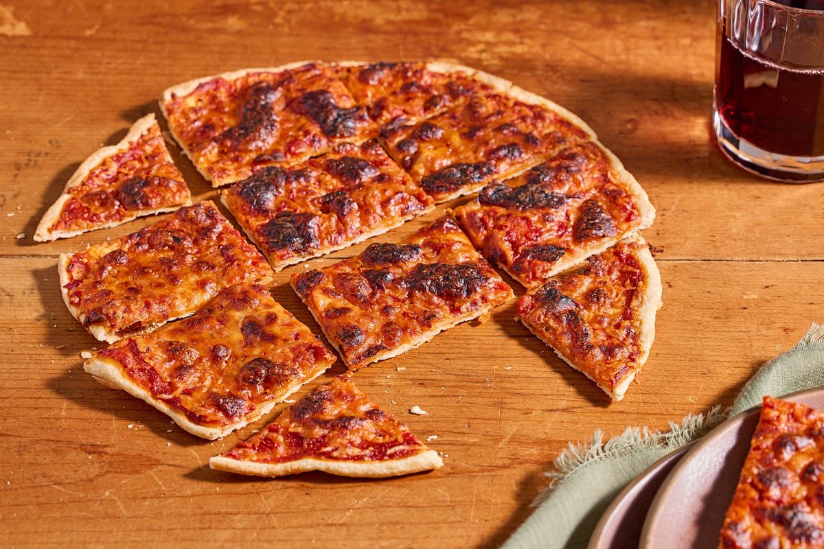 This recipe for a thin and crispy pizza dough is based on the one available at Domino’s, which has developed a cult following, including from chefs. (Tom McCorkle/ for The Washington Post/food styling by Gina Nistico/For The Washington Post)