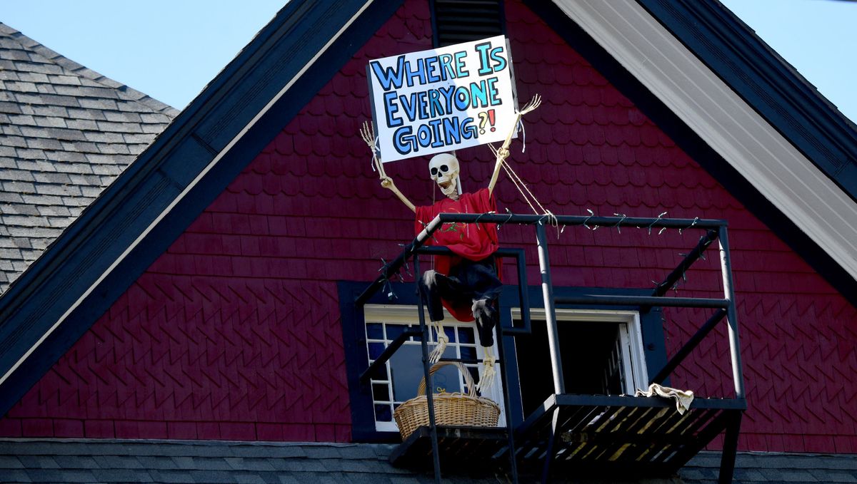LEFT: “Where is everyone going?!” was a sign on display in Browne’s Addition during Bloomsday.  (Kathy Plonka/The Spokesman-Review)