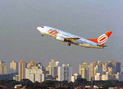 
A Gol airline jet takes off at the Congonhas Airport in Sao Paulo, Brazil, on Monday. Brazil's newest airline, the low-cost carrier Gol, plans to buy up to 43 Boeing passenger jets in a $2.7 billion deal that could triple its fleet of planes flying in Latin America's largest country, the company announced Monday.A Gol airline jet takes off at the Congonhas Airport in Sao Paulo, Brazil, on Monday. Brazil's newest airline, the low-cost carrier Gol, plans to buy up to 43 Boeing passenger jets in a $2.7 billion deal that could triple its fleet of planes flying in Latin America's largest country, the company announced Monday.
 (Associated PressAssociated Press / The Spokesman-Review)