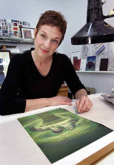 
Artist Mary GrandPre poses in her Sarasota, Fla., studio March 4 with her artwork for the newest Harry Potter book, 