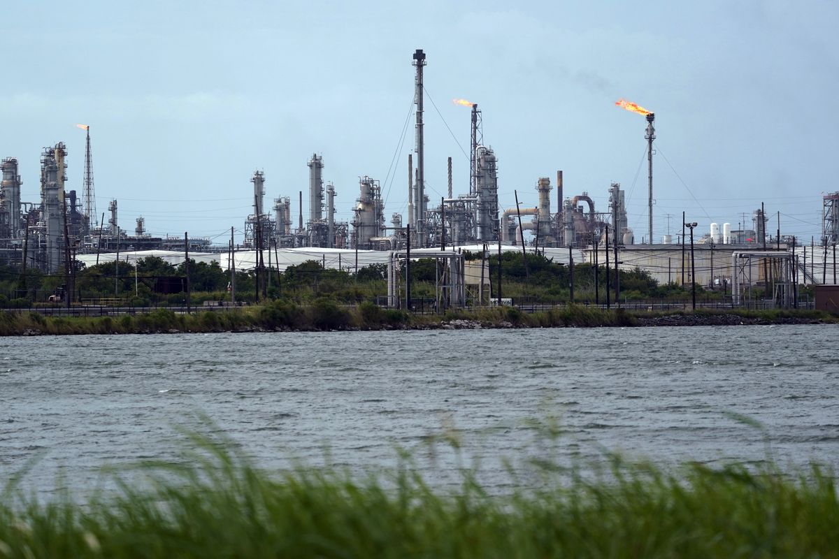 A refinery is seen along the water, Wednesday, Aug. 26, 2020, in Port Arthur, Texas. The energy industry braced for catastrophic storm surges and winds as Hurricane Laura cuts a dangerous path toward the coastlines of Texas and Louisiana. On Thursday, officials were assessing possible damage from the hurricane. (Eric Gay/Associated Press)