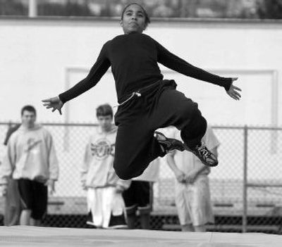 
West Valley High School Bri Almy works on her long jump technique. She will compete in both the sprints and long jump  this spring. She finished third at the state track meet in the long jump last year. 
 (The Spokesman-Review)