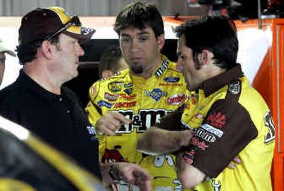 
Fast-rising NASCAR star Elliott Sadler, center, discusses strategy with Todd Parrott, left, and Dave Smith.
 (Associated Press / The Spokesman-Review)