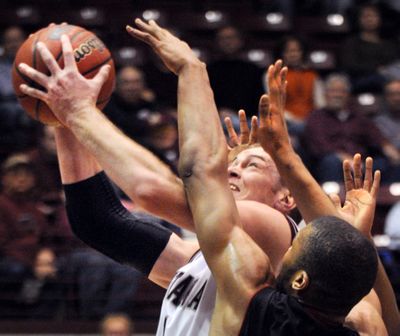 Montana's Brain Qvale takes it strong to the hoop during an NCAA college basketball game against Eastern Washington on Thursday, Jan. 13, 2011 in Missoula, Mont. (Michael Gallacher / The Missoulian)