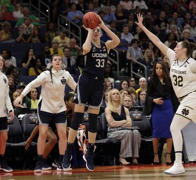 Connecticut guard Katie Lou Samuelson (33) attempt a 3-point shot as Notre Dame forward Jessica Shepard (32) defends during the second half of a Final Four semifinal of the NCAA women’s college basketball tournament Friday, April 5, 2019, in Tampa, Fla. (Chris O'Meara / Associated Press)