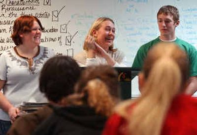 
East Valley High Link students, from left, Samantha Toy, 18, Cori Christianson, 18, and Cory Williams, 17, discuss other ways to be involved in school besides academics with a freshman class at East Valley High.
 (Liz Kishimoto / The Spokesman-Review)