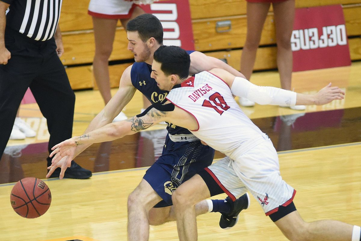 Eastern Washington guard Jacob Davison (10) reaches in for a steal against Montana State forward Ladan Ricketts (11) on Saturday, Feb. 8, 2020 at Reese Court in Cheney. (James Snook / For The Spokesman-Review)