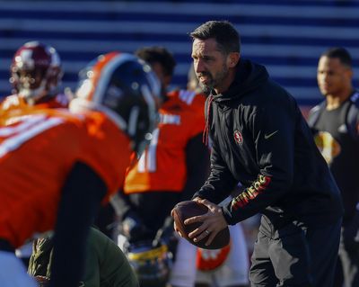 South head coach Kyle Shanahan of the San Francisco 49ers takes a snap during practice for Saturday's Senior Bowl college football game, Thursday, Jan. 24, 2019, in Mobile, Ala. (Butch Dill / AP)