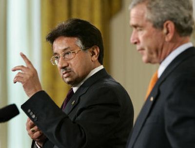 
President Bush, right, listens as Pakistani President Gen. Pervez Musharraf answers a question Friday in the East Room of the White House. 
 (Associated Press / The Spokesman-Review)
