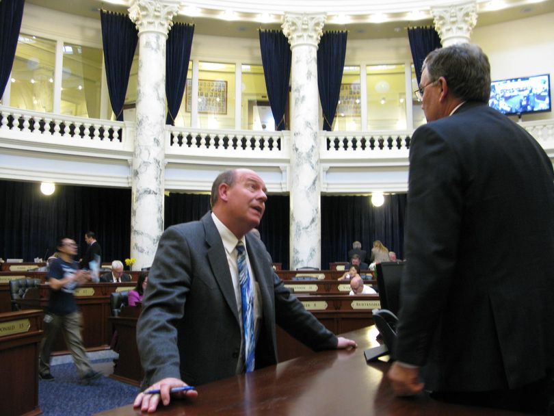 House Majority Leader Mike Moyle, left, talks to House Speaker Scott Bedke, right, as the House is at ease on Thursday afternoon. (Betsy Z. Russell)