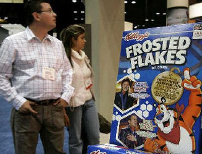 
Buyers from around the world who visit Kellogg's display at the Food Marketing Institute's annual show in Chicago see the cereal king's commitment to advancing its market share into the Hispanic community.  
 (Associated Press / The Spokesman-Review)