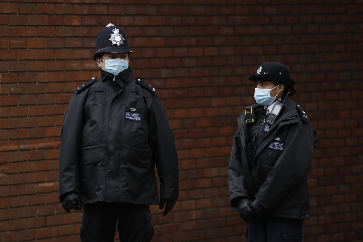 Police officers stand outside the King Edward VII Hospital in London, Friday, Feb. 19, 2021. Buckingham Palace said the husband of Queen Elizabeth II, 99-year-old Prince Philip was admitted to the private King Edward VII Hospital on Tuesday evening after feeling unwell.  (Matt Dunham/Associated Press)